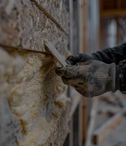 Closed-cell spray foam applied to a framed wall