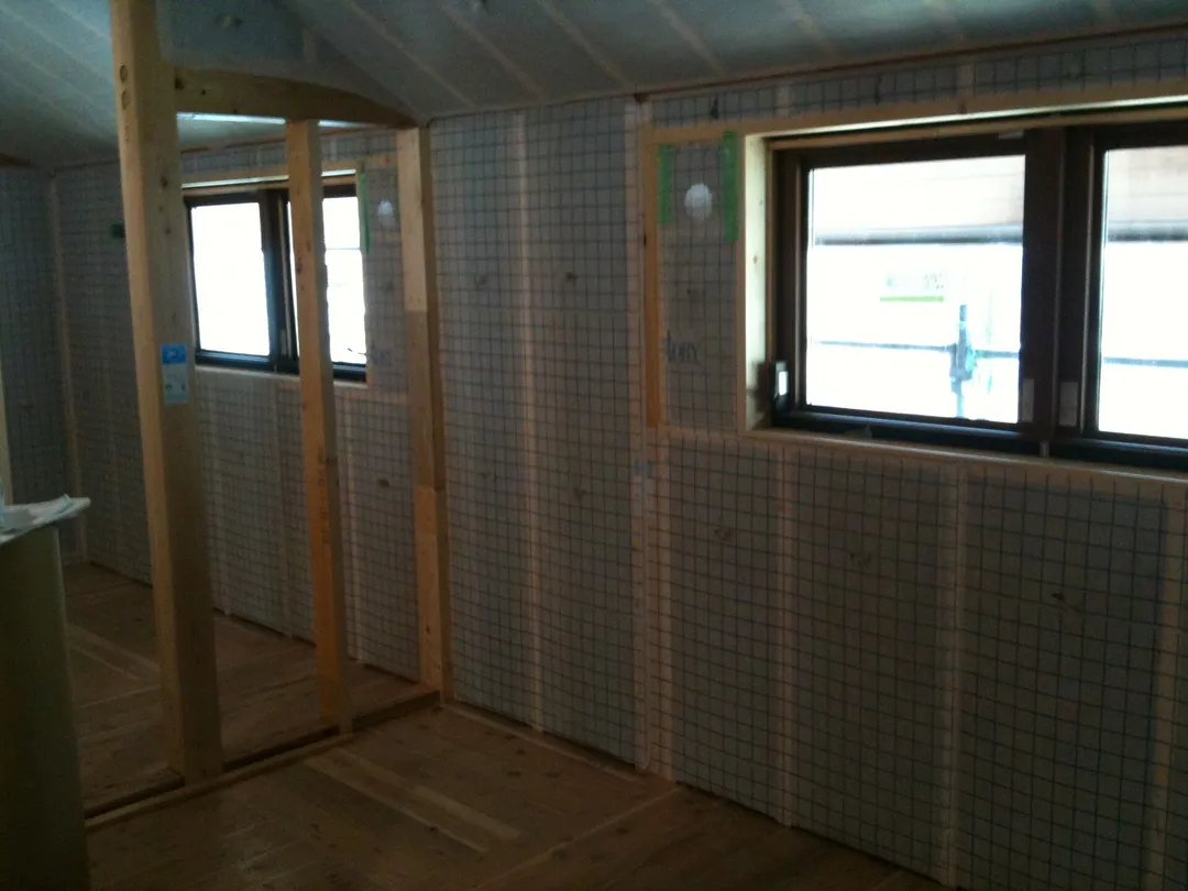 A new-construction interior with walls prepared for insulation