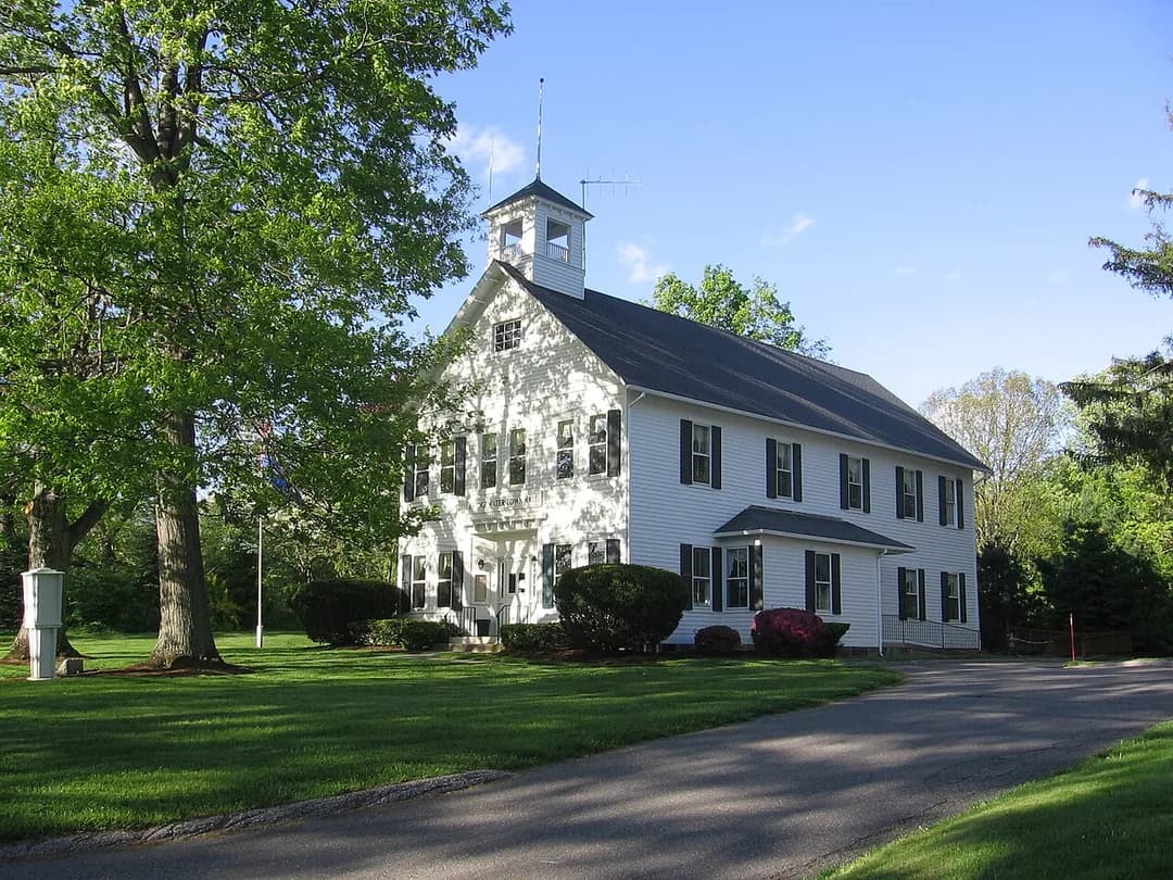 The white clapboard Bridgewater Town Hall with its bell cupola in Bridgewater, Connecticut