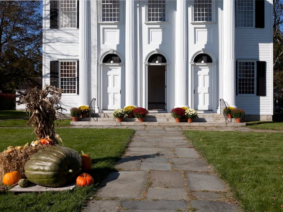 The First Congregational Church with an autumn harvest display in Litchfield, Connecticut
