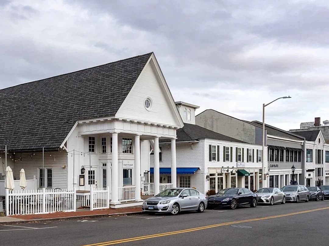 White colonial storefronts along the downtown village in New Canaan, Connecticut